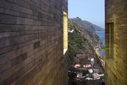 The void between the stone volumes in the foreground. The town a Paulo David - Centro da Artes, casa das Mudas, Calheta Portugal