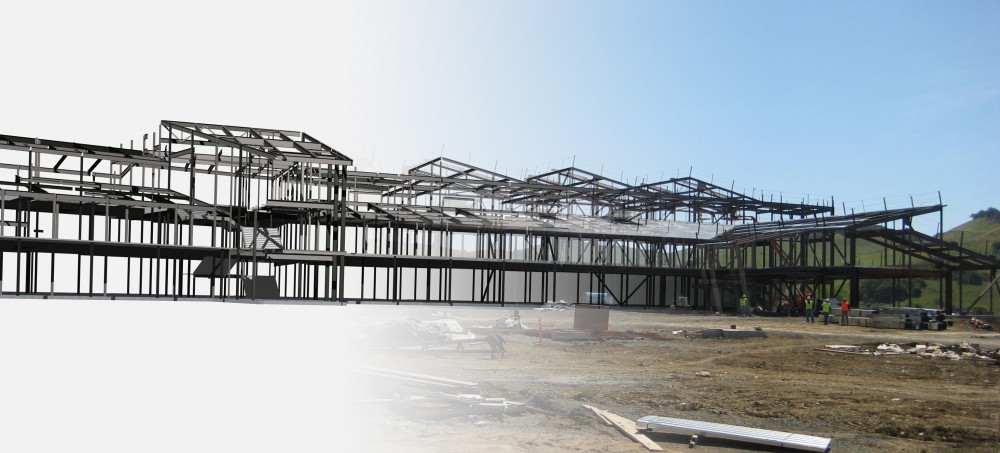 American Canyon High School, American Canyon, CA.  Rendering of BIM model of building structure overlaid with construction photo of steel frame. American Canyon High School, American Canyon, CA. Rendering of BIM model of building structure overlaid with construction photo of steel frame.