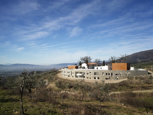 Health Centre and Houses for Elderly People / IPOSTUDIO Architects