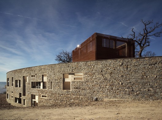 Health Centre and Houses for Elderly People / IPOSTUDIO Architects