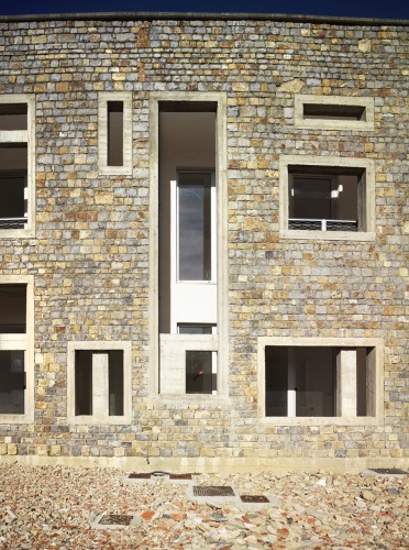 Health Centre and Houses for Elderly People / IPOSTUDIO Architects