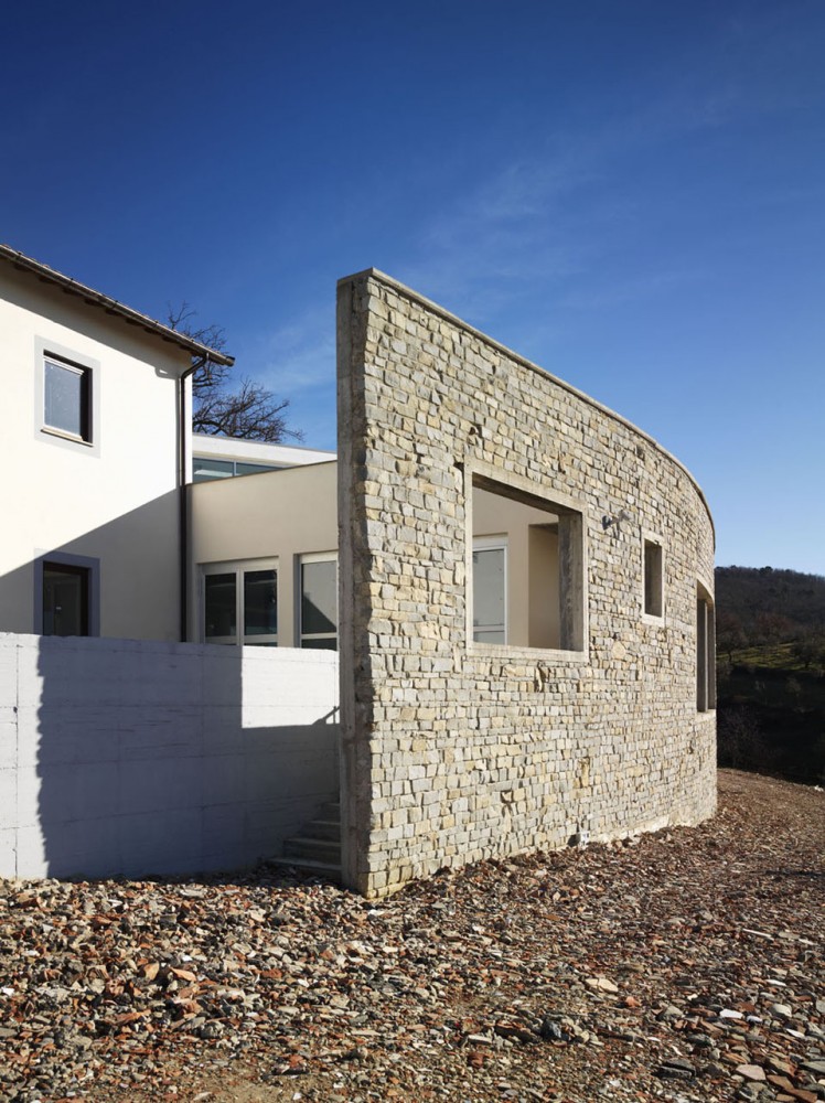 Health Centre and Houses for Elderly People / IPOSTUDIO Architects