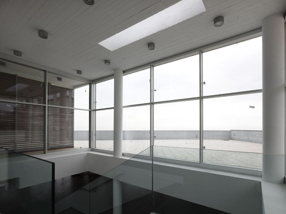 Health Centre and Houses for Elderly People / IPOSTUDIO Architects