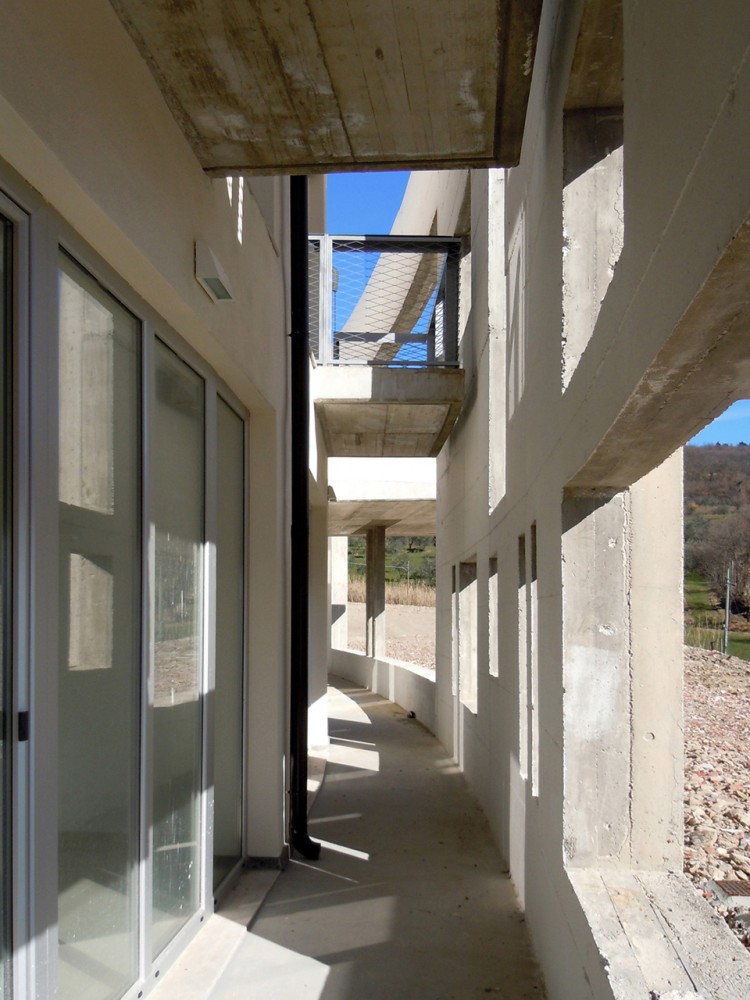 Health Centre and Houses for Elderly People / IPOSTUDIO Architects
