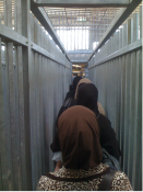 Women going though Kalandia © Harris Silver