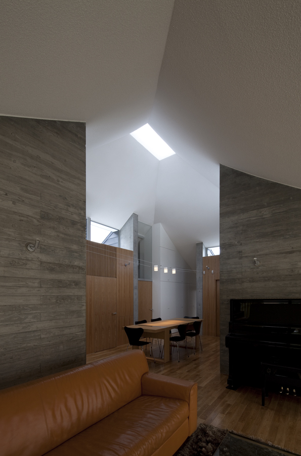 Broken Pitched Roof House / NKS Architects