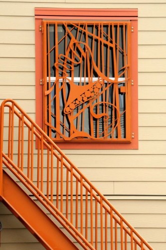 The YWCA Pierce County shelter, part of the Building Design project, uses artwork to mitigate the negative affect of security bars. Image courtesy of YWCA Pierce County.