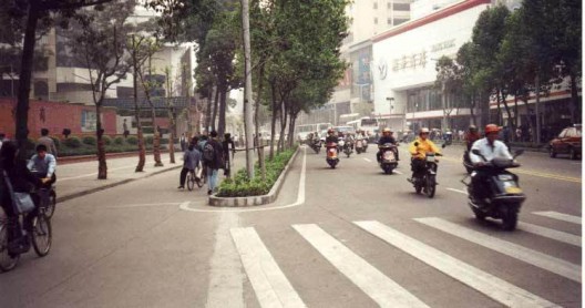 An accessible travel chain begins with safe streets and sidewalks. This street in Foshan, China, has separate rights-of-way for pedestrians, human-powered vehicles, and motor-powered vehicles