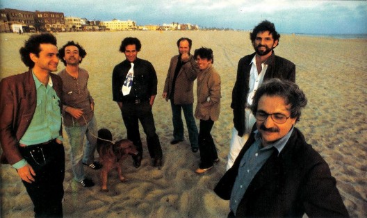 Seven of the architects who participated in the Architecture Gallery, from left to right: Frederick Fisher, Robert Mangurian, Eric Owen Moss, Coy Howard, Craig Hodgetts, Thom Mayne, and Frank Gehry at Venice Beach, 1980 / Photograph by Ave Pildas / Digital Image / Image courtesy of the artist. / © Ave Pildas