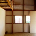 Prototype Housing I / Collective Studio Prototype Housing I / Collective Studio Interior entry showing fiber cement sheeting and timber frame