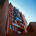 Red Apple Apartment Building / Aedes Studio Red Apple Apartment Building / Aedes Studio Courtesy of Aedes Studio
