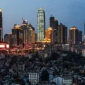 The old buildings under these high-rises in Chongqing have been marked for demolition. © Justin Jin for The New York Times
