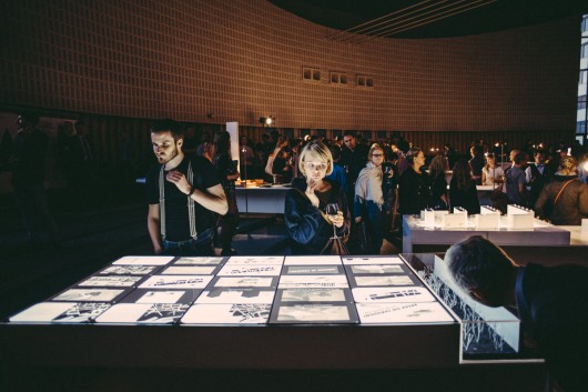 The opening event of the TAB 2013 Curators’ Exhibition in the Ministry of Foreign Affairs (a modernist/Soviet landmark highrise in Tallinn, originally built as the headquarters of the Communist Party) on September 6th, 2013. Architectural model in this photo (foreground): TAB Curators’ Exhibition work by the Estonian team of Kavakava architects, KUU architects and the philosopher Eik Hermann. Image © Tonu Tunnel