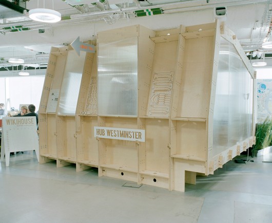 A WikiHouse prototype is used as a meeting area. Image © Kate Peters via Metropolis Magazine