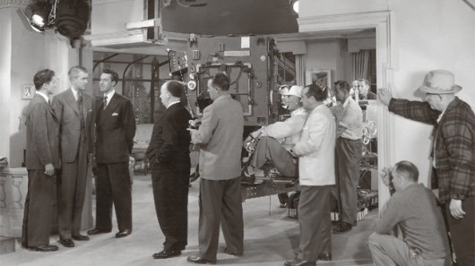Hitchcock on the set of Rope, with actors Jimmy Steward, John Dall, and Farley Granger. Image Courtesy of nai010 publishers