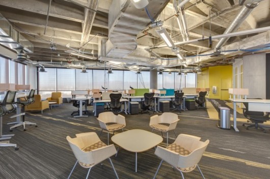 Zappos is one of the biggest companies to function as a ‘holocracy’ (without a fixed staff hierarchy). Their Las Vegas headquarters utilizes communal furniture to increase team-based collaboration (according to Business Insider, ‘desks are linked but can be easily disconnected or moved, the walls are movable as well. So if a team needs to work a different way, or a new product team is formed, the space can be changed, and changed again until it works’). Image Courtesy of Zappos, via OfficeSnapshots.com