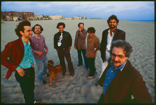 L.A. Architects at Venice Beach, 1980. Left to right: Frederick Fisher, Robert Mangurian, Eric Owen Moss, Coy Howard, Craig Hodgetts, Thom Mayne, and Frank Gehry. Photo by Ave Pildas