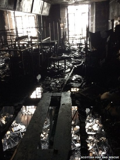 The wreckage of the Glasgow School of Art Library. Image © Scottish Fire and Rescue via BBC