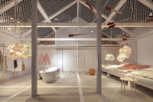 The space is filled with inventive details, including a 100-year-old stoneware tub (above) and a wall of 573 tools for the kitchen-cum-workshop (below). Image Courtesy of Constantin Meyer/Koelnmess
