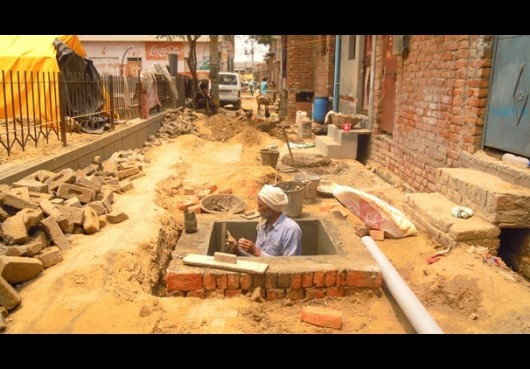 New manholes under construction in Savda Ghevra. Image Courtesy of The Architects Journal