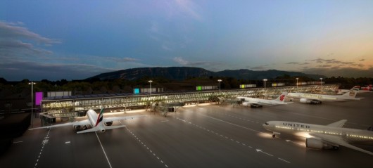 External view of Geneva Airport East Wing at dusk. Image Courtesy of RBI-T consortium