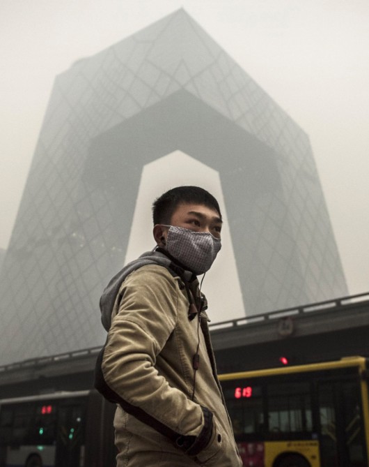 The CCTV Building, Beijing, cloaked by air pollution. Image © Kevin Frayer / Getty Images