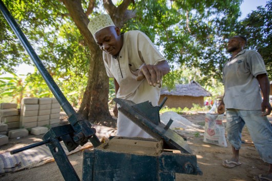 Local block maker Ali Cedric making blocks for sale in Pujini, Pemba Island. Image © Craig Norris