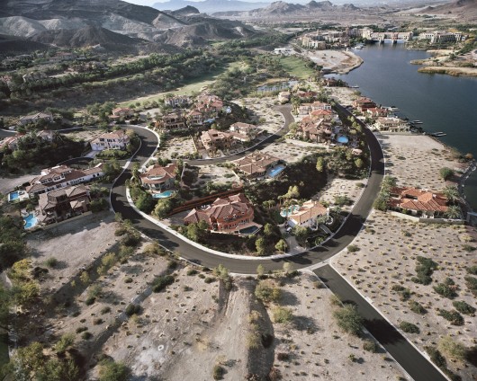Gated “Monaco” Lake Las Vegas Homes, Bankrupt Ponte Vecchio Beyond, Henderson, NV; 2010. Image © Michael Light, Lake Las Vegas/Black Mountain